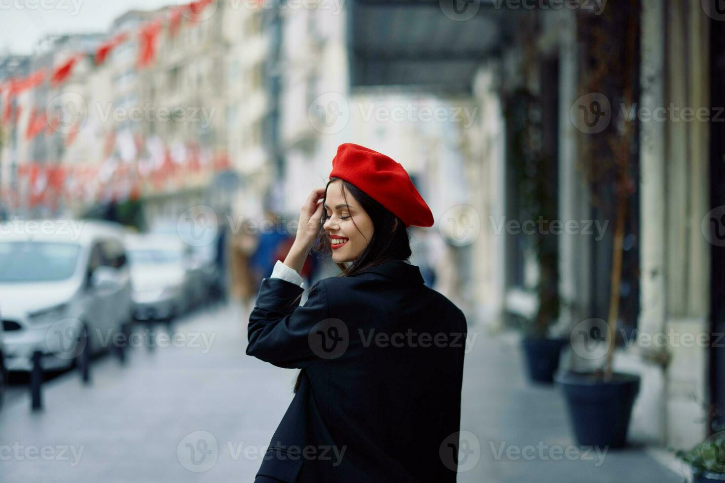 Woman happiness view from the back, follow me walks walks in the city against the backdrop of office buildings, stylish fashionable vintage clothes and makeup, spring walk, travel. photo