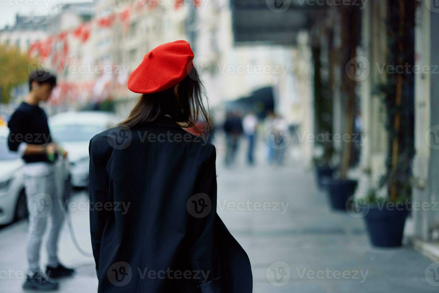 Happiness woman walks walks in the city against the backdrop of office buildings, stylish fashionable vintage clothes and make-up, spring walk, travel. photo