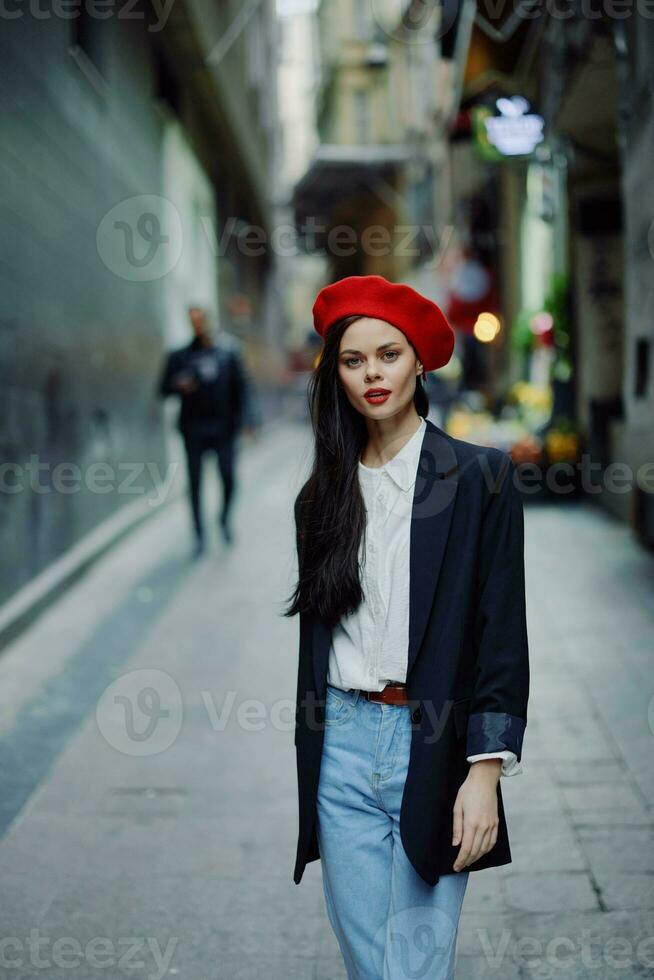 Fashion woman portrait walking tourist in stylish clothes with red lips walking down narrow city street, travel, cinematic color, retro vintage style, dramatic. photo