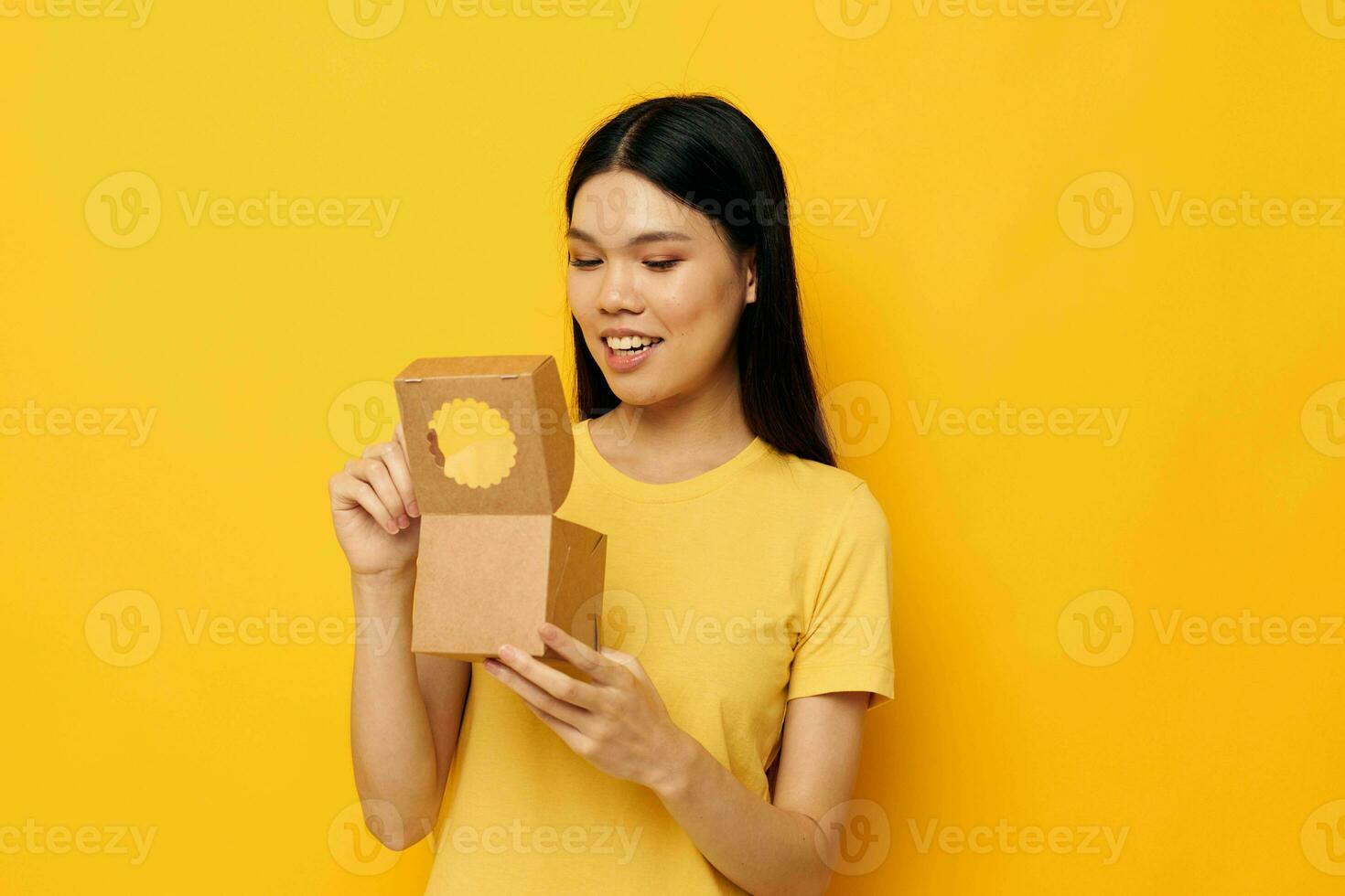 cute asian girl with a small box in her hands monochrome shot photo