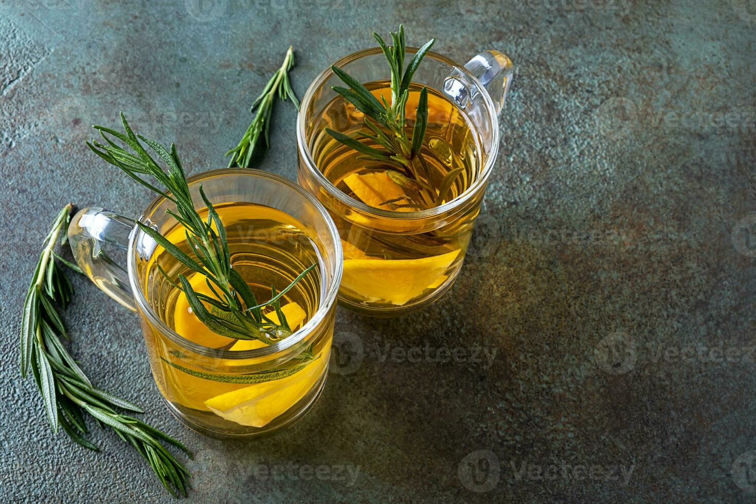 Rosemary tea in two glass cups. photo