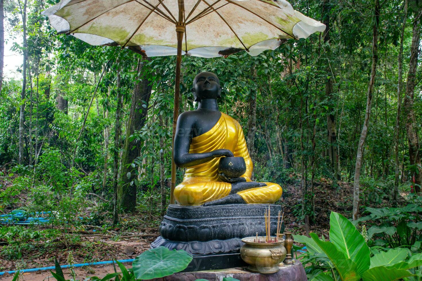 Statue of a monk Pra Upakhut photo
