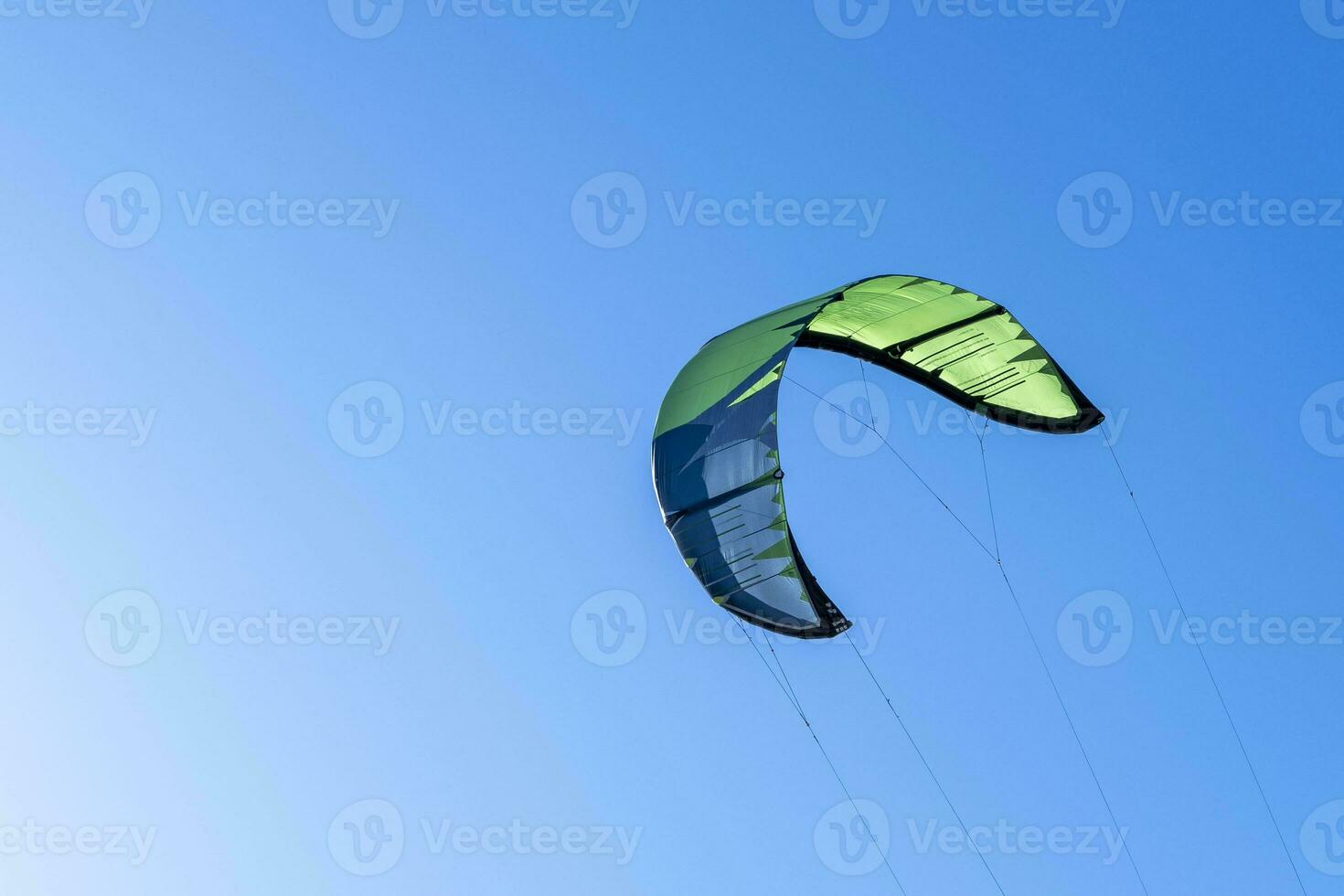 wing of kitesurfing against the blue sky . Kitesurfing on the sea photo