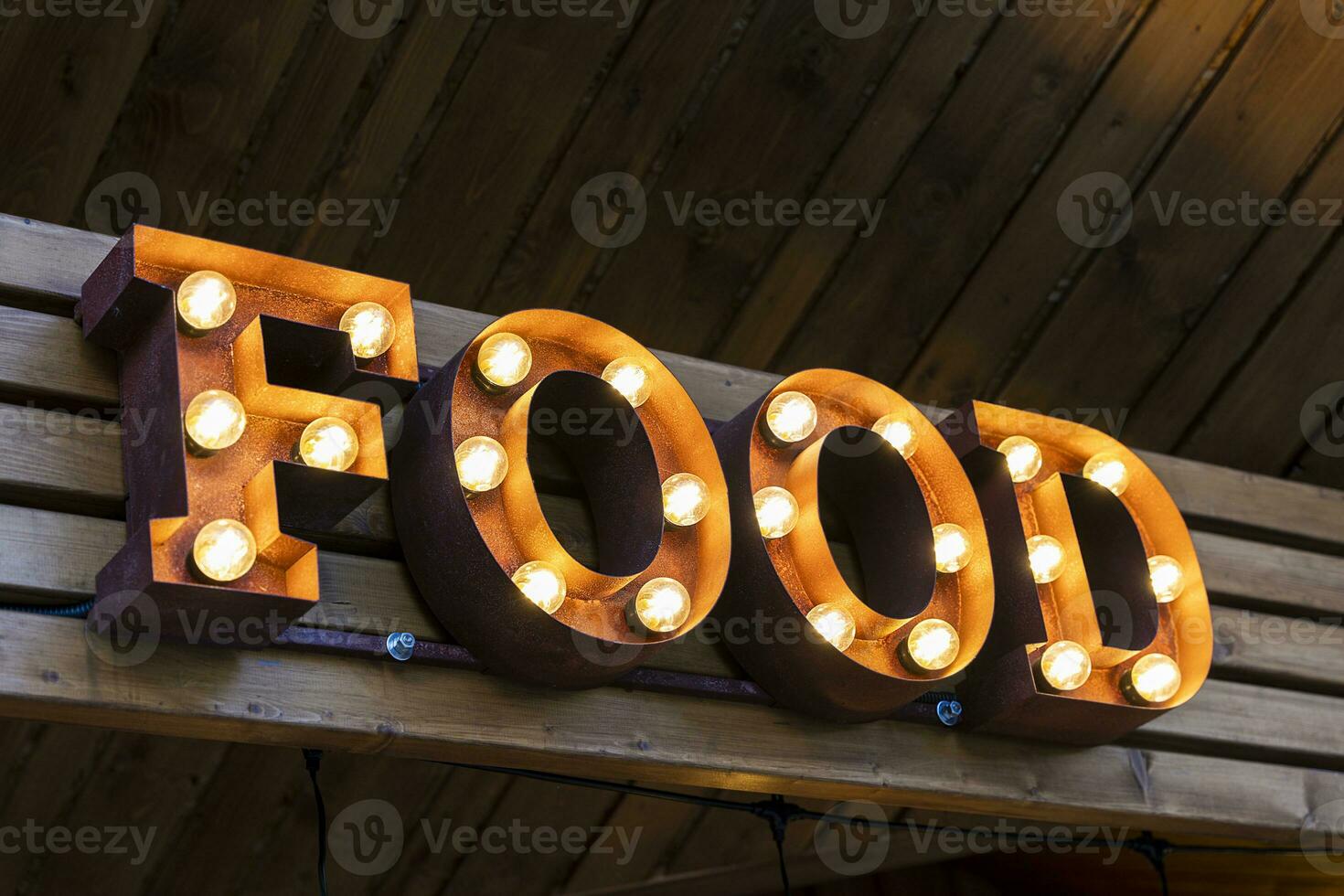 the glowing street sign of the FOOD street cafe photo