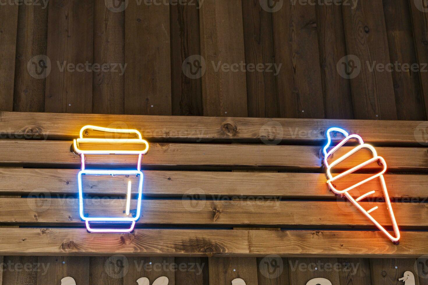 Glowing neon icons of street food, ice cream and coffee mugs photo