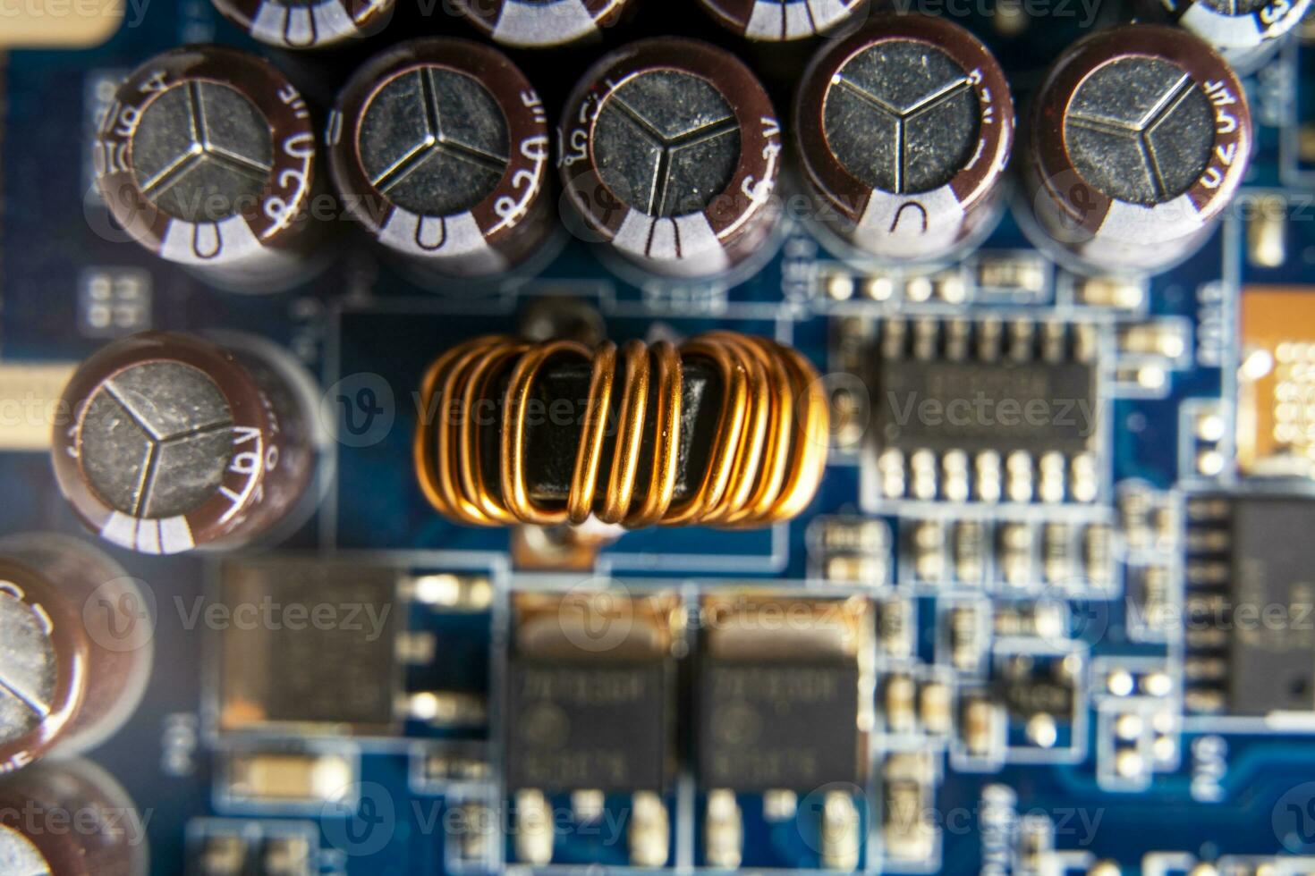 Background of various electronic components on printed circuit board photo
