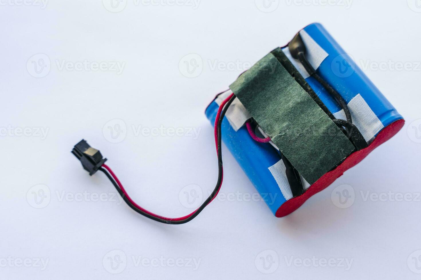 broken lithium battery pack with wires and a terminal photo