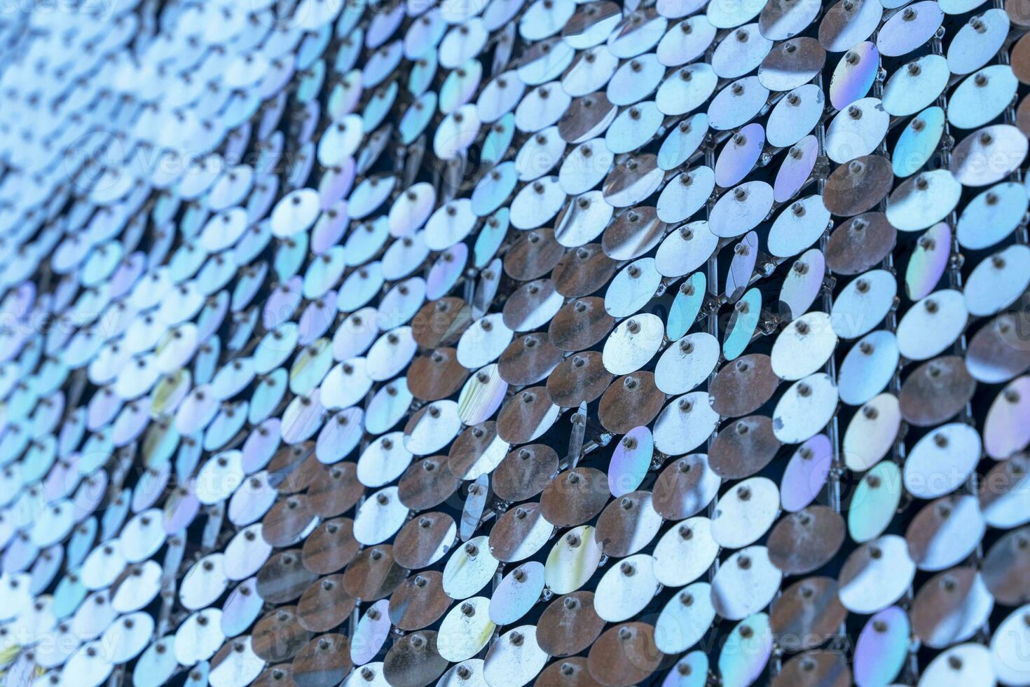 abstract background of silver disks suspended on strings. sparkling photo