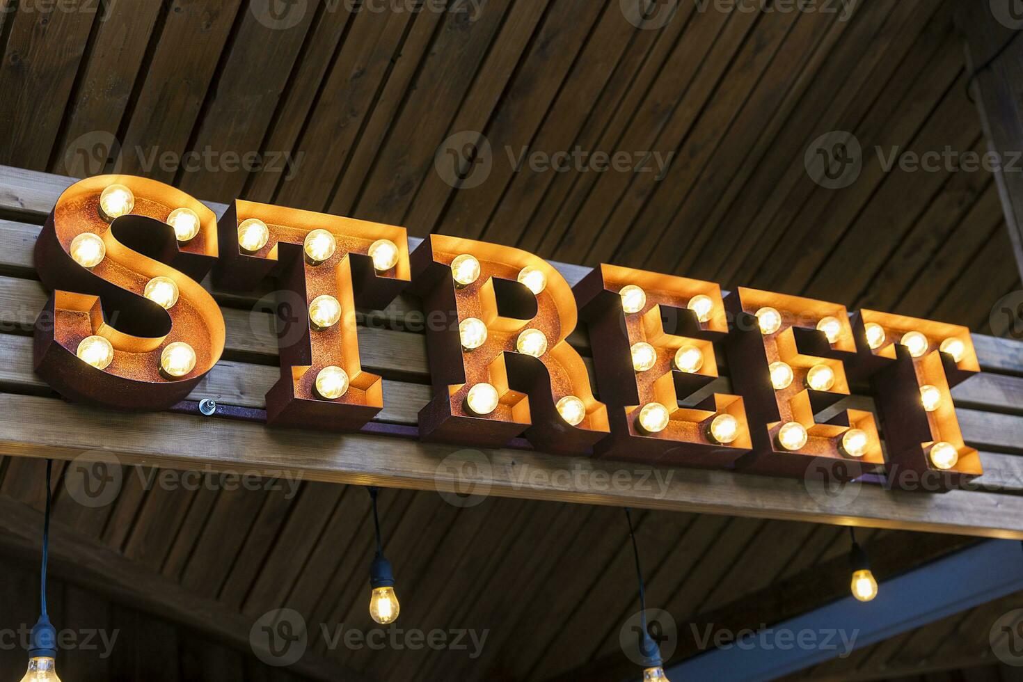 the glowing street sign of the STREET street cafe photo