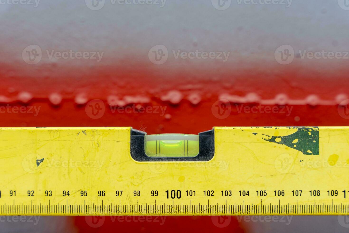 bubble construction level with a length marking on a gray background photo