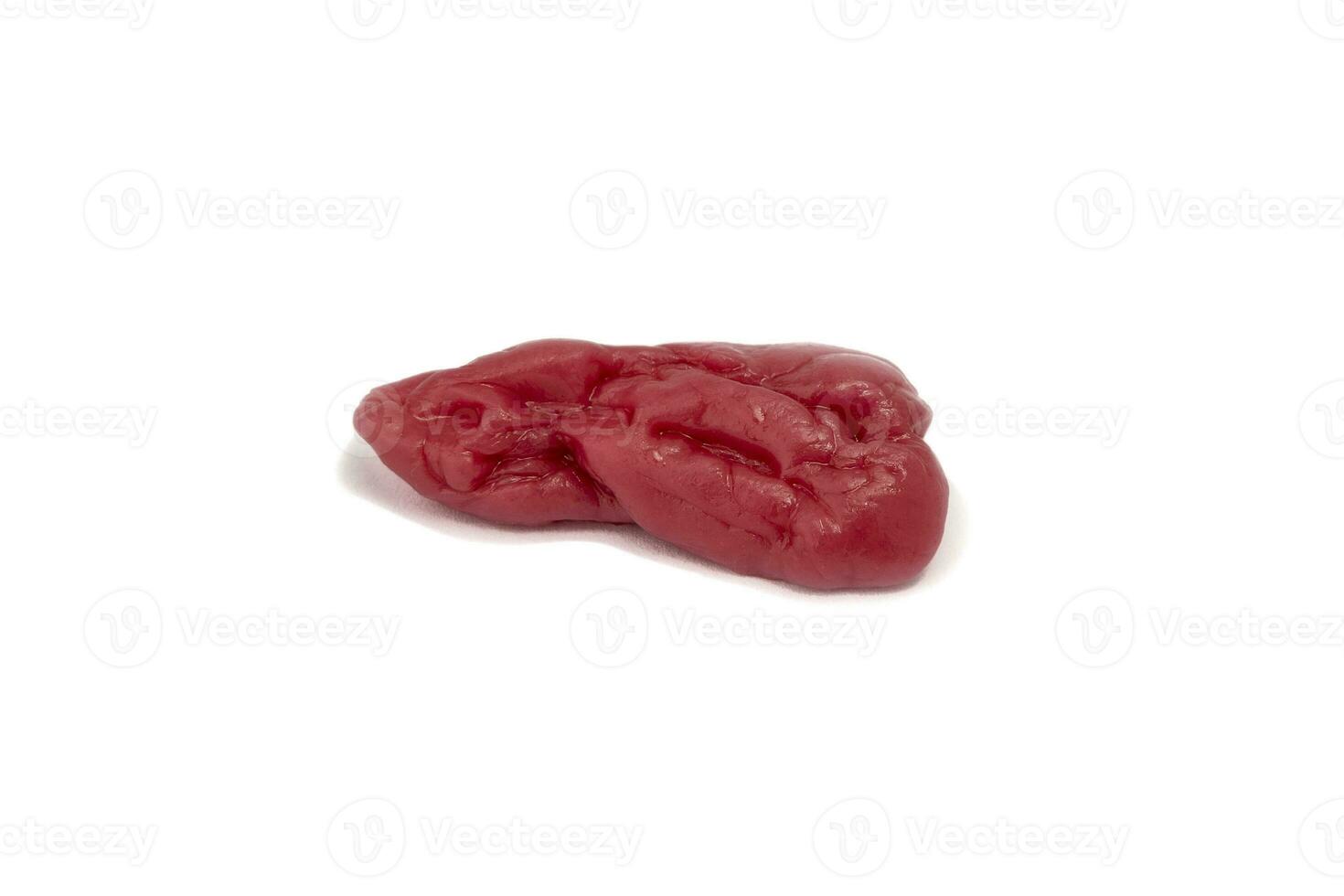 Chewed used pink chewing gum is isolated on a white background photo