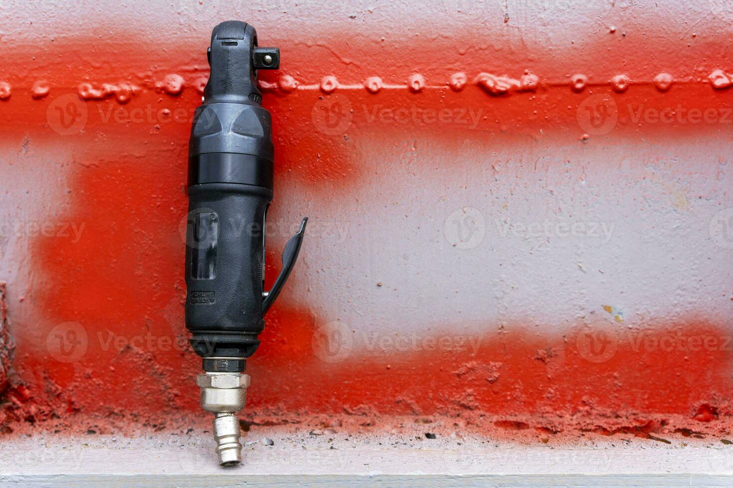 air ratchet wrench. angular pneumatic wrench on a gray background