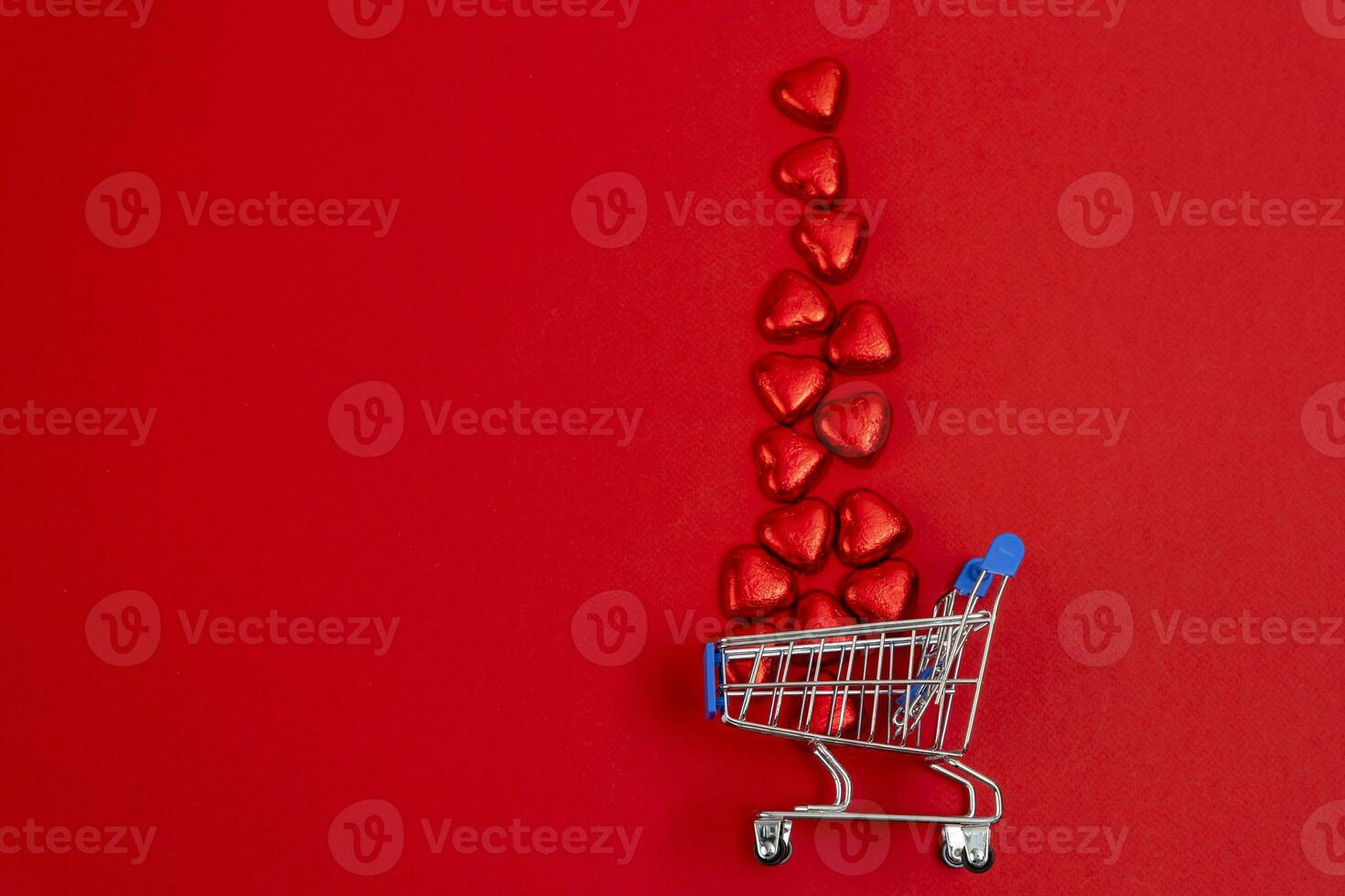 red festive Christmas background with a supermarket cart photo