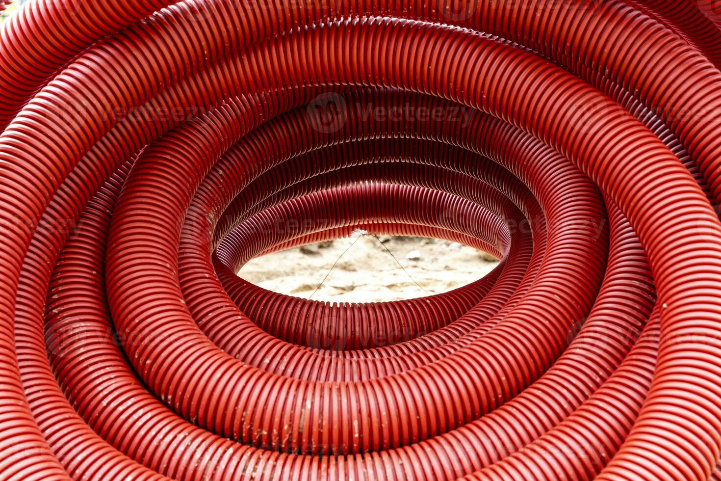 red corrugated pvc pipe for underground electrical cable laying photo