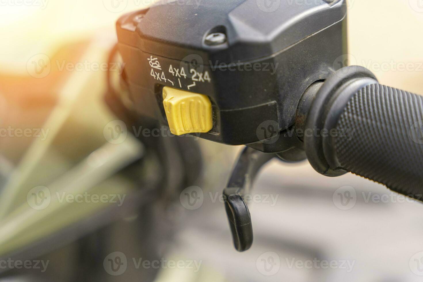 atv controls close-up. switches on the handlebar of the ATV photo
