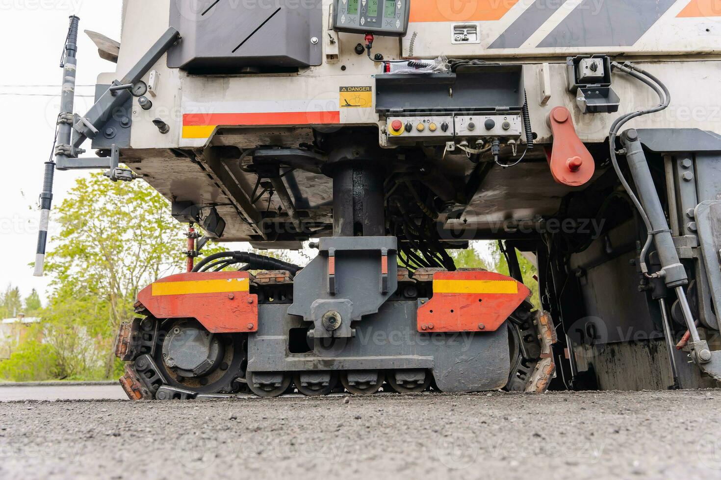 Large Road cold milling machine removes the old asphalt and loading photo