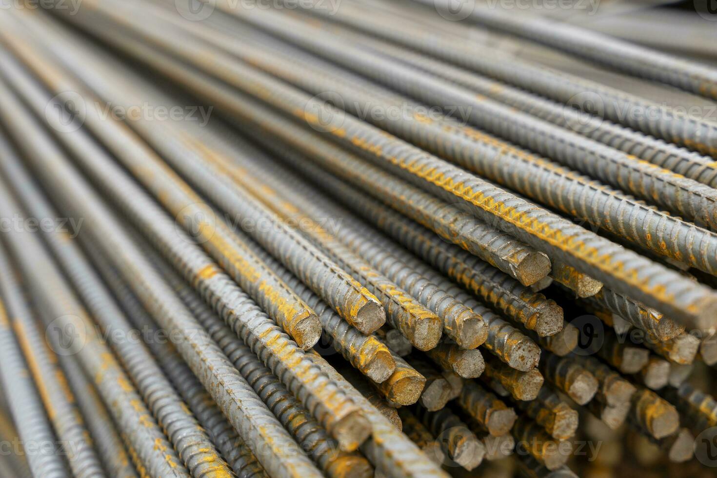 A large bundle of iron construction fittings in close-up photo