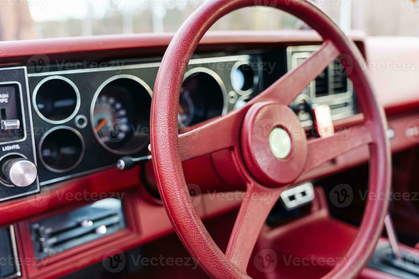 red steering wheel, dashboard of an old powerful classic American car photo