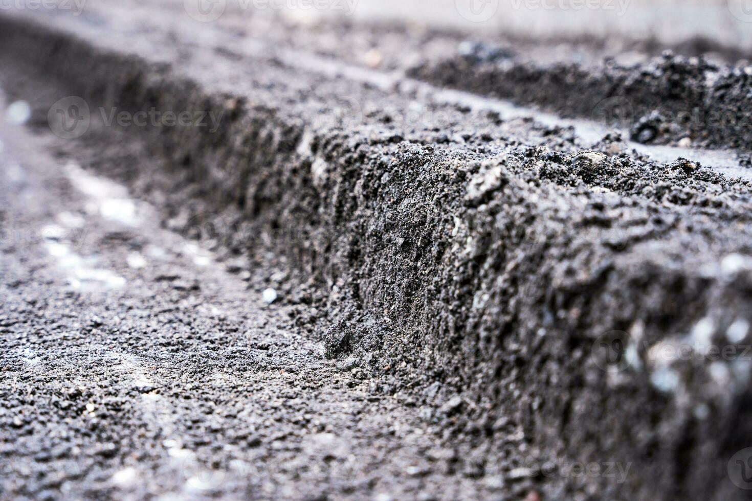 A close view of a cross-section of the old road surfac. repair photo