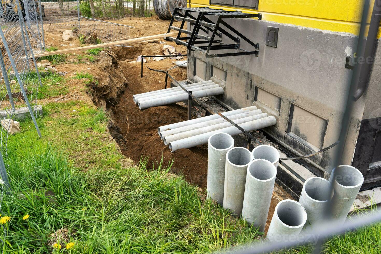 asbestos embedded pipes come out of the electrical panel. photo