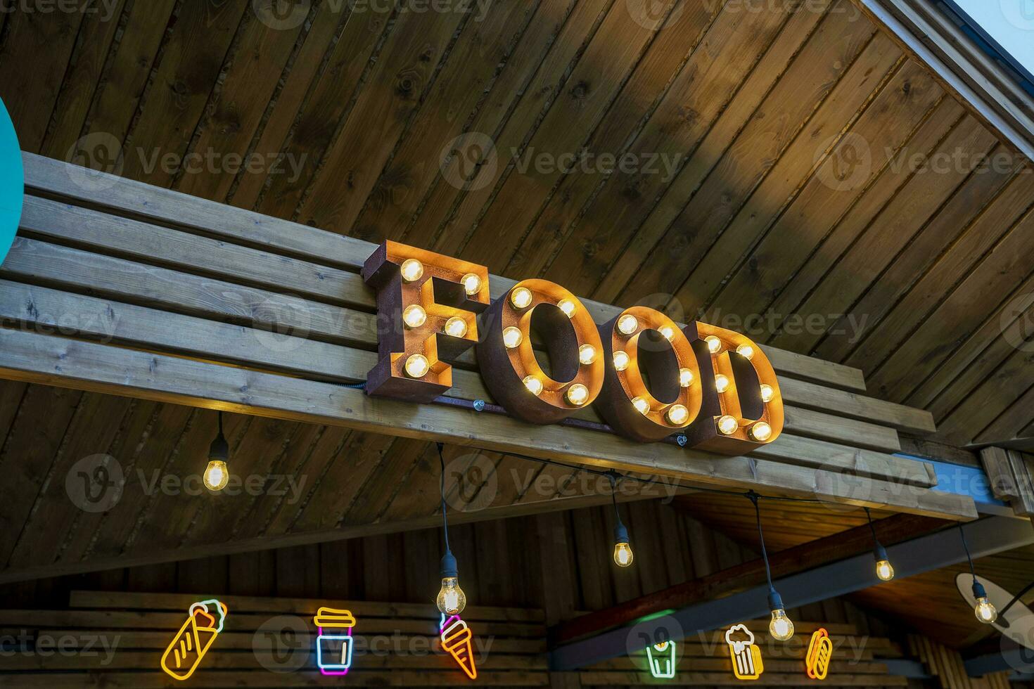 the glowing street sign of the FOOD street cafe photo