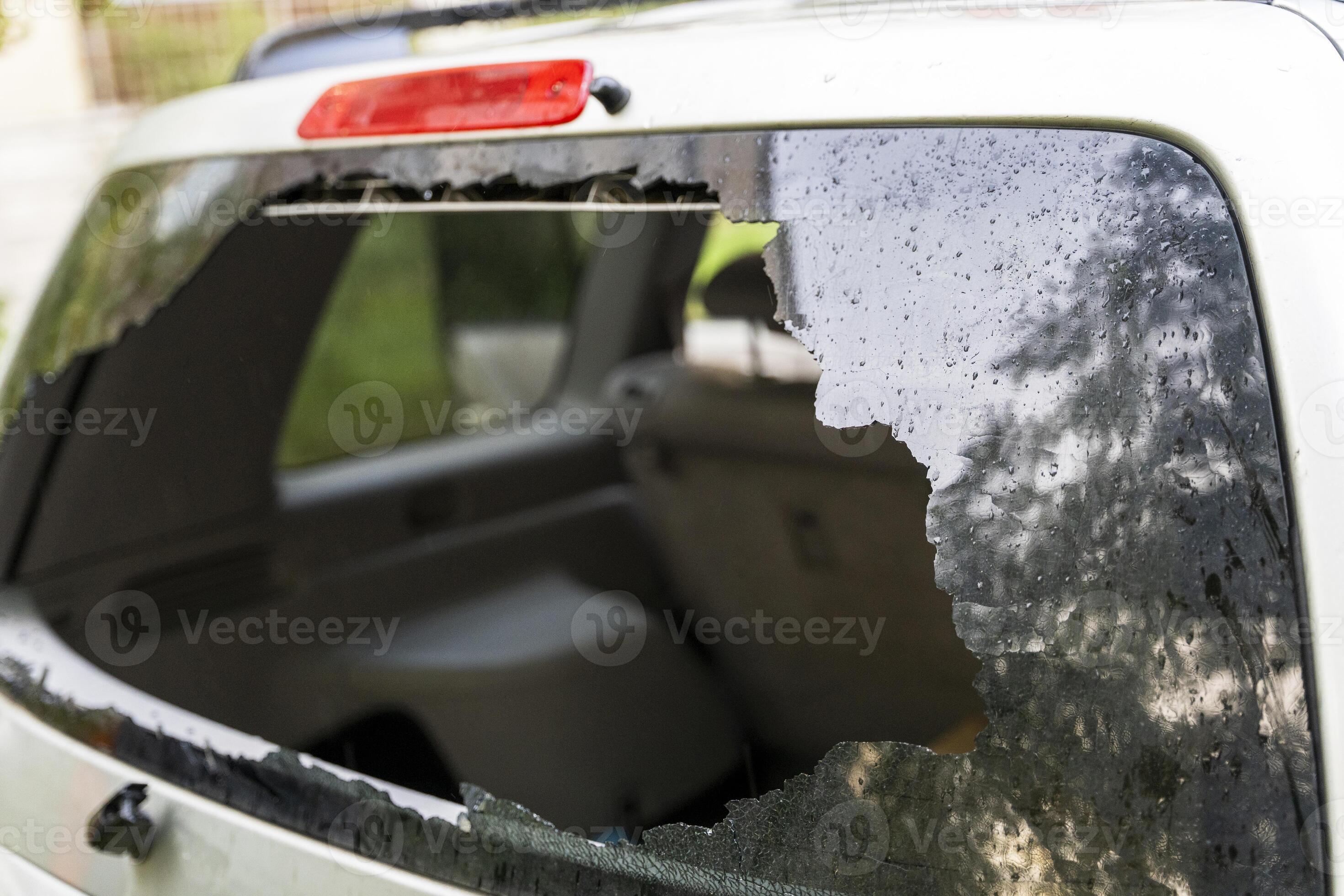 broken rear window of the car. the remains of car glass in the window