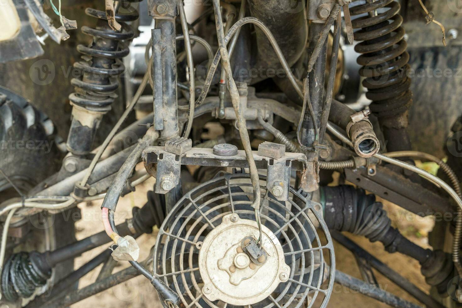 the front part of a broken and disassembled ATV in need of repair photo