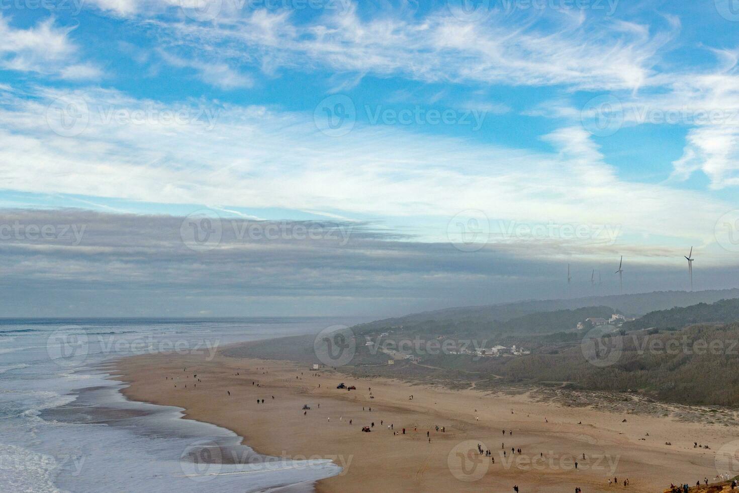 The coastline of Portugal is the best place to relax. Big waves in the Atlantic Ocean for surfing and meditation. photo