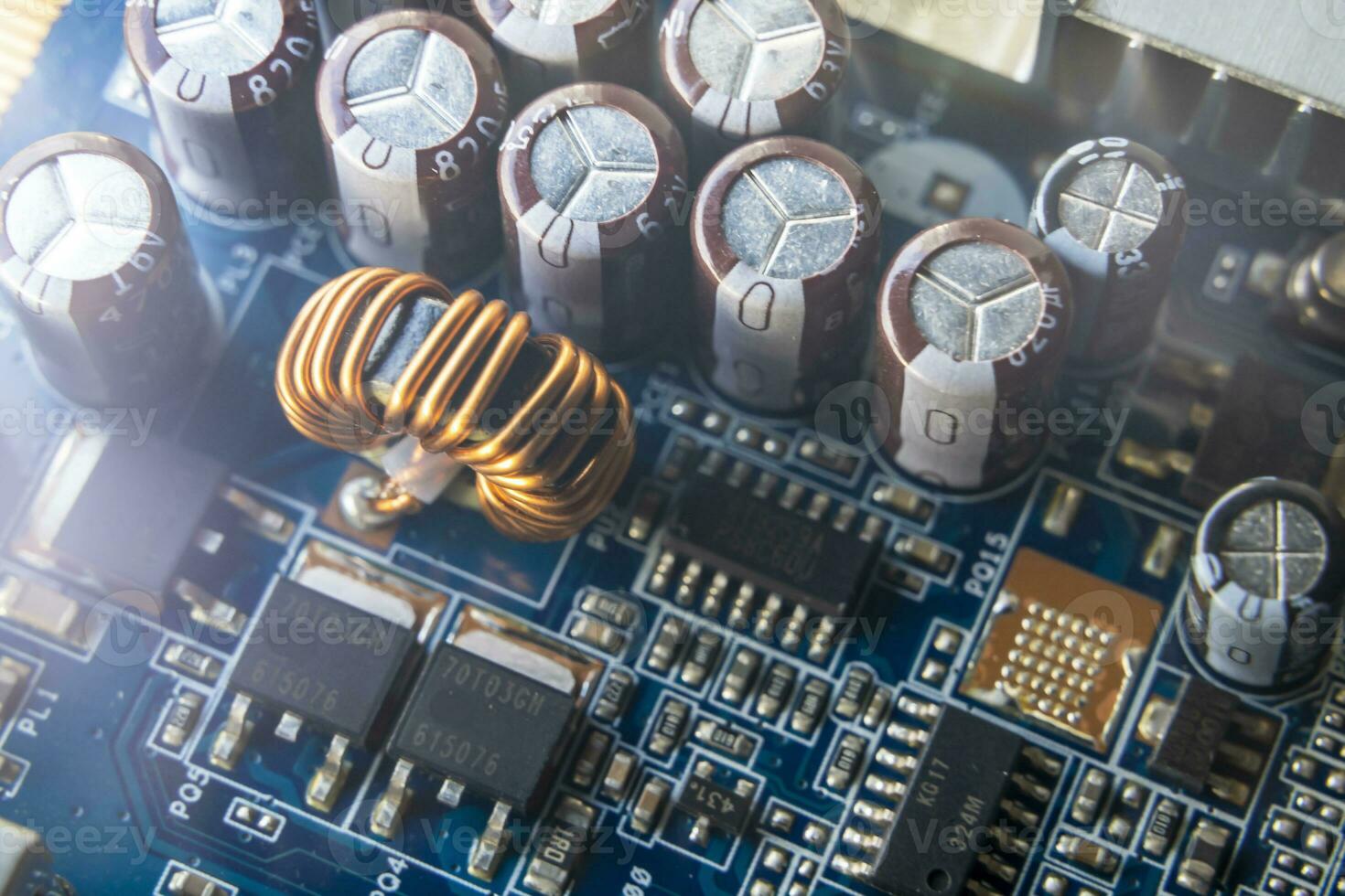 Background of various electronic components on printed circuit board photo