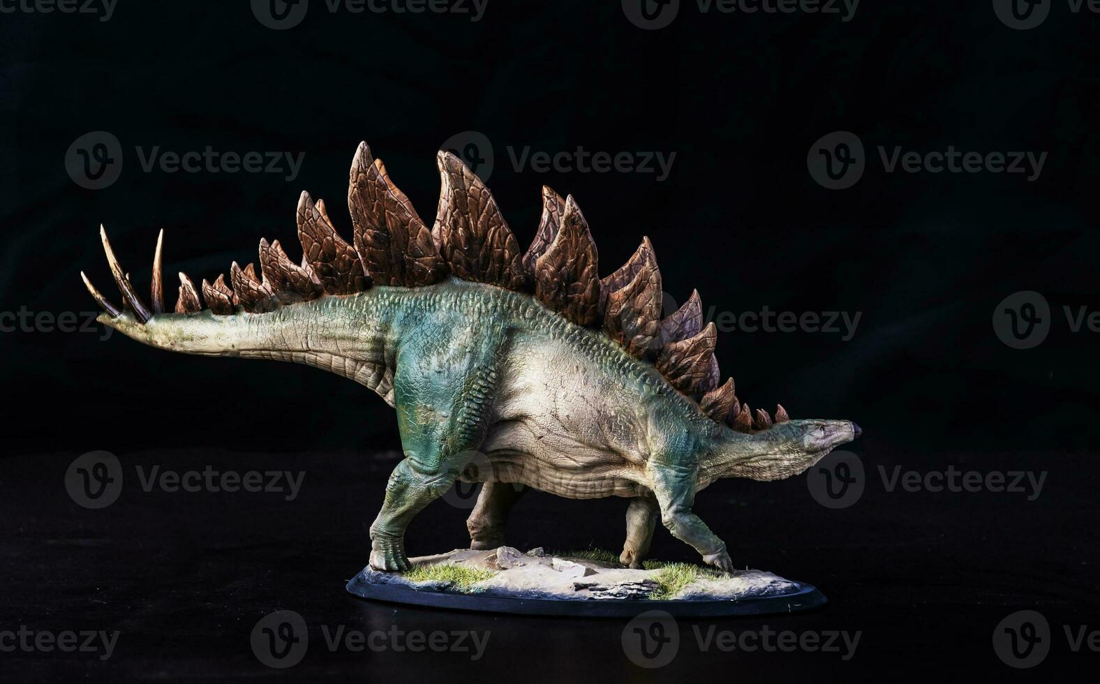 Dinosaur stegosaurus in the dark photo