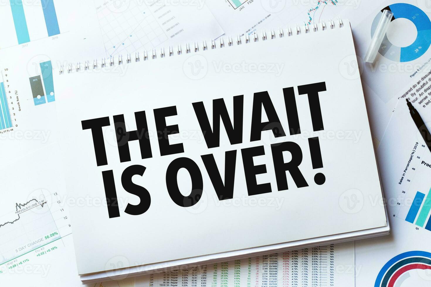 Notebook with Tools and Notes with text the wait is over photo