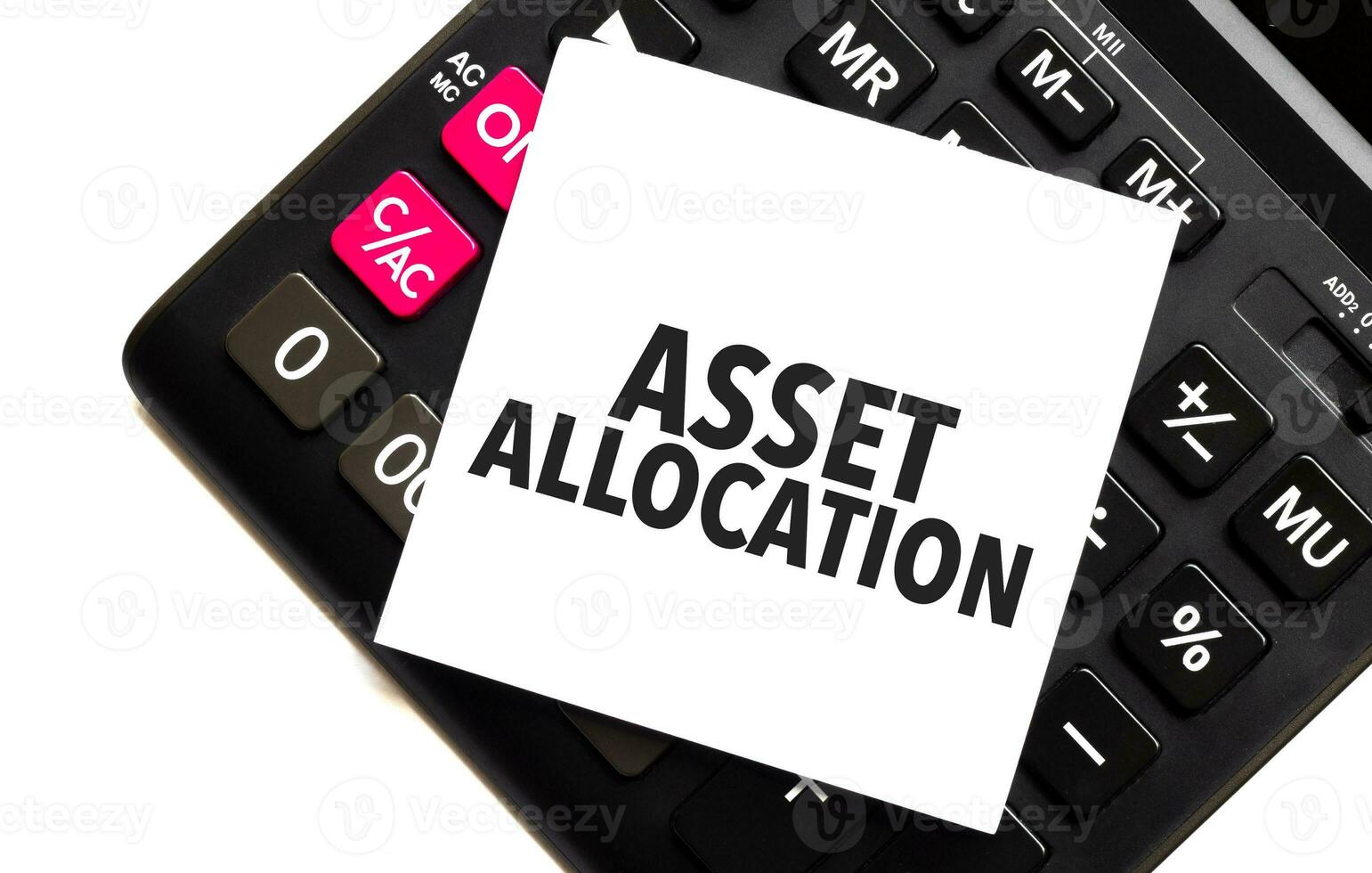 words ASSET ALLOCATION on white sticker and calculator on white background photo