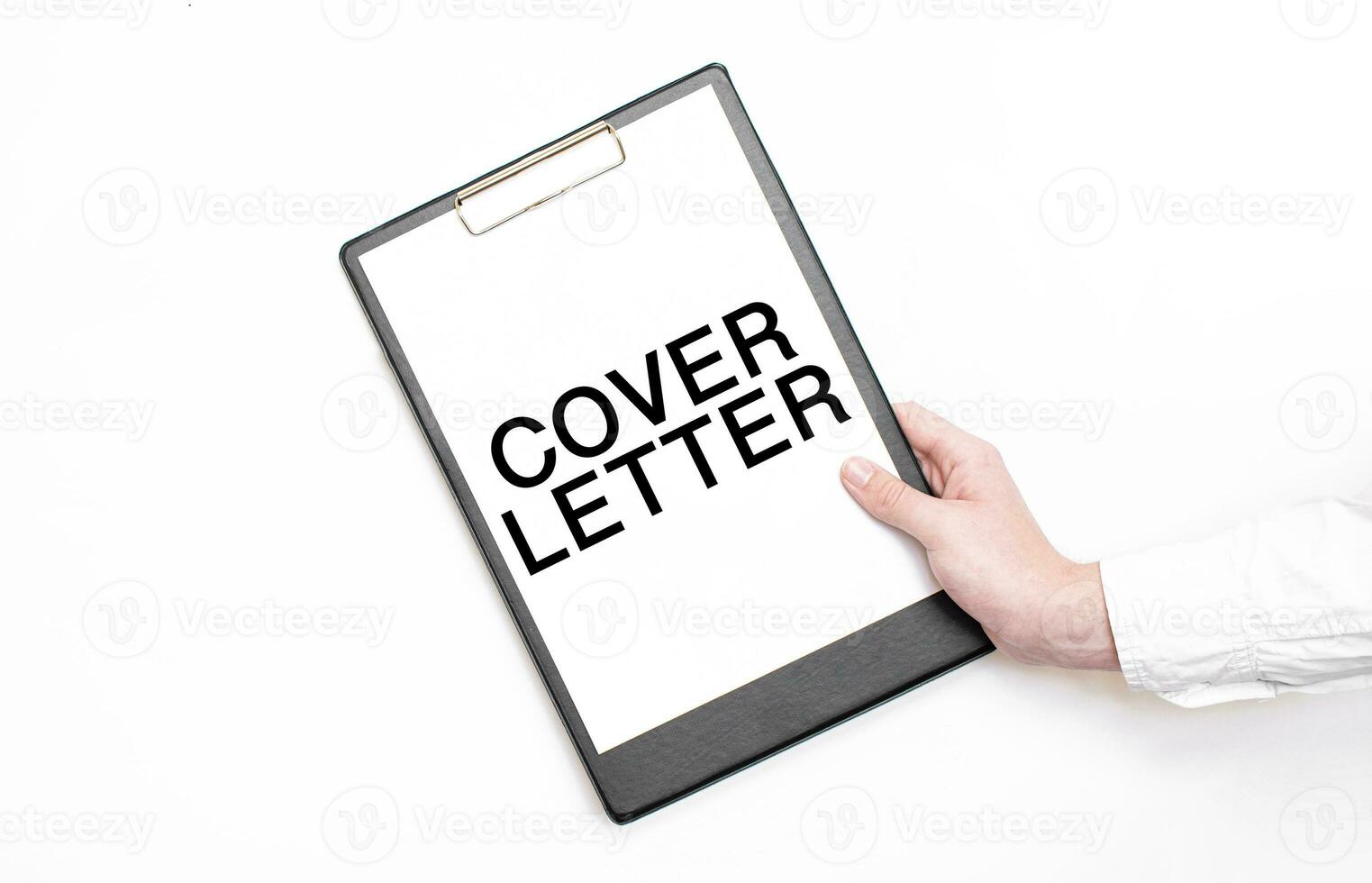 A businessman holds a folder with paper sheet with the text COVER LETTER. Business concept. photo