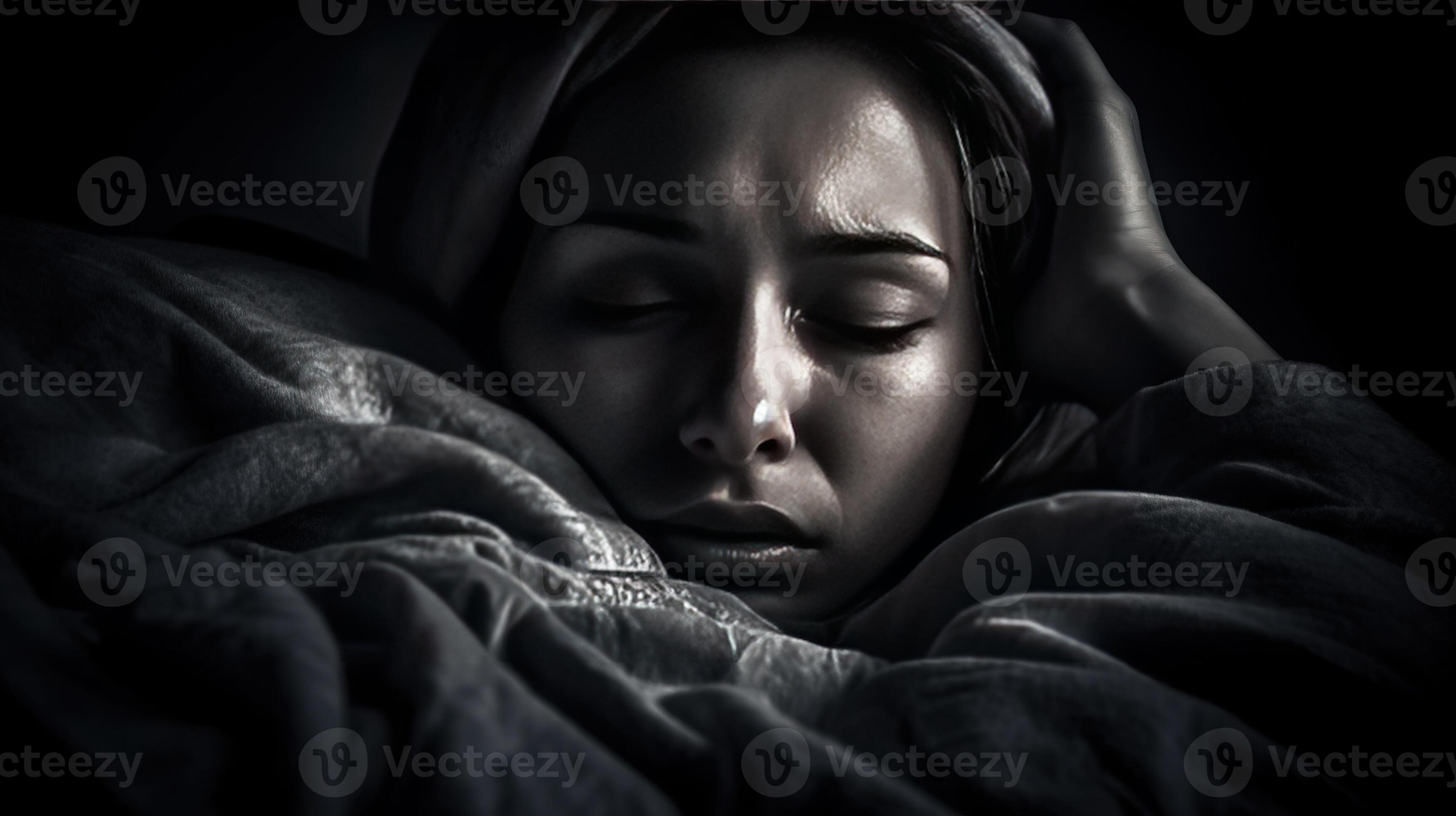 Concept of insomnia. Woman does not sleep at night in bed in light of