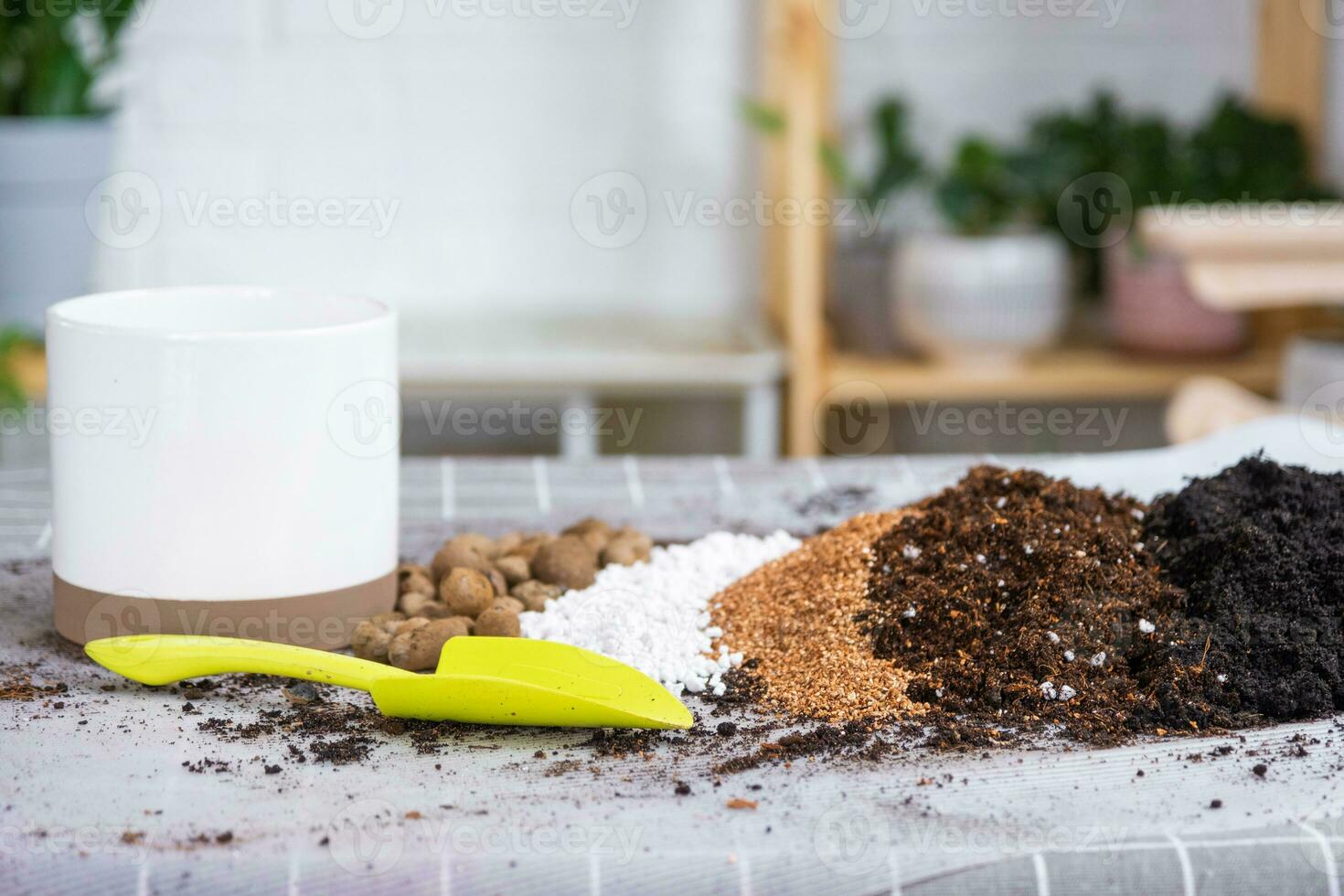 Ingredients for the soil of home potted plants, peat, earth, sand, perlite, vermiculite, coconut. A mixture for planting plants in a pot. Layout photo
