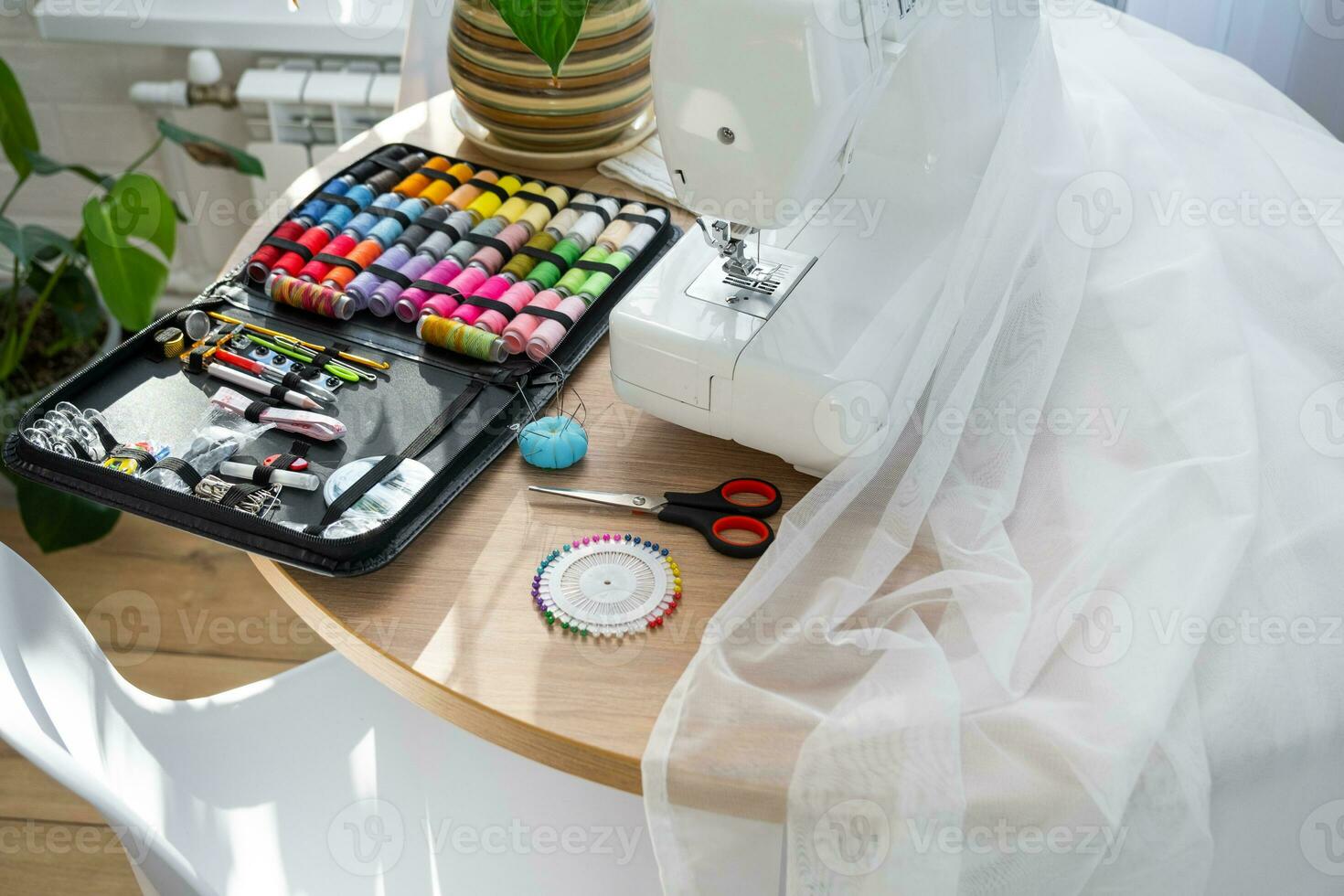 Sewing layout with multicolored spools of thread close-up, needles, electric sewing machine. Filling the thread into the sewing needle, adjusting the tension. hobby, home business photo