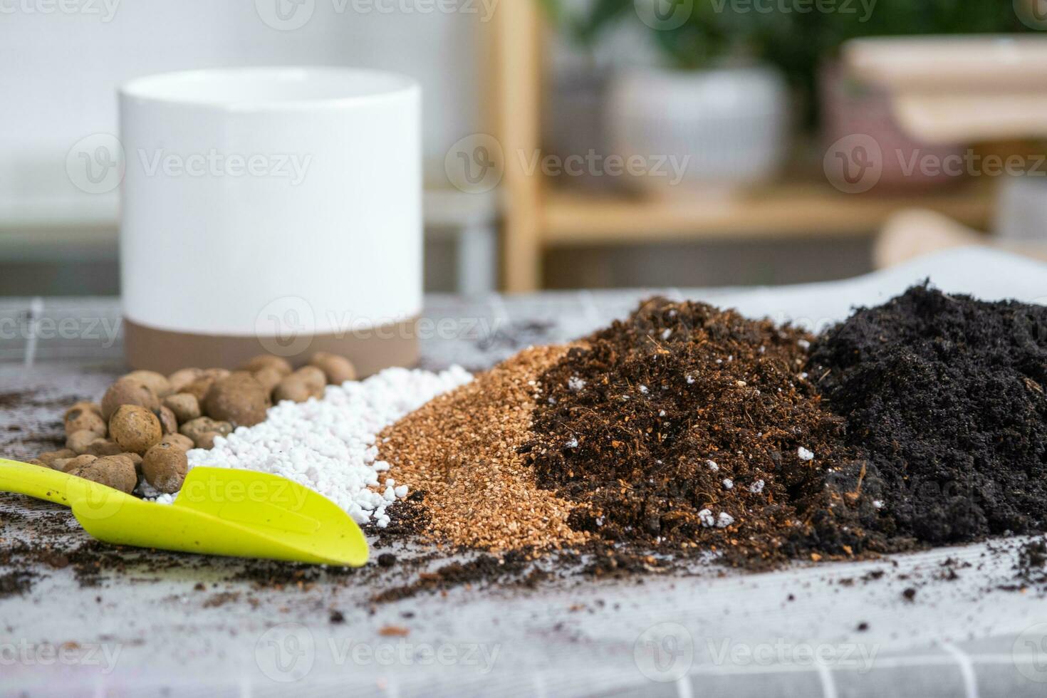 Ingredients for the soil of home potted plants, peat, earth, sand, perlite, vermiculite, coconut. A mixture for planting plants in a pot. Layout photo