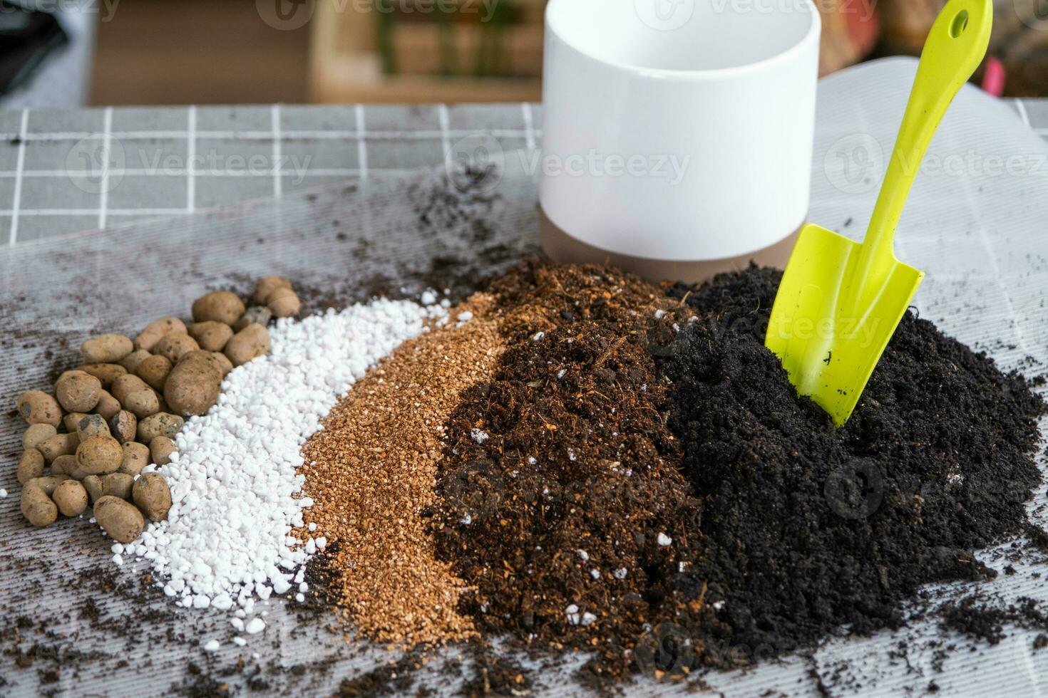Ingredients for the soil of home potted plants, peat, earth, sand, perlite, vermiculite, coconut. A mixture for planting plants in a pot. Layout photo