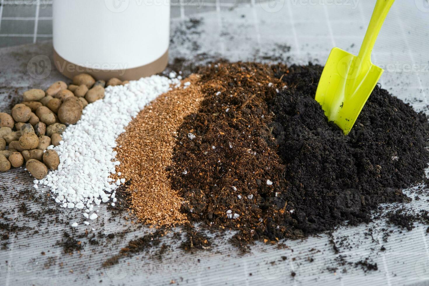 Ingredients for the soil of home potted plants, peat, earth, sand, perlite, vermiculite, coconut. A mixture for planting plants in a pot. Layout photo