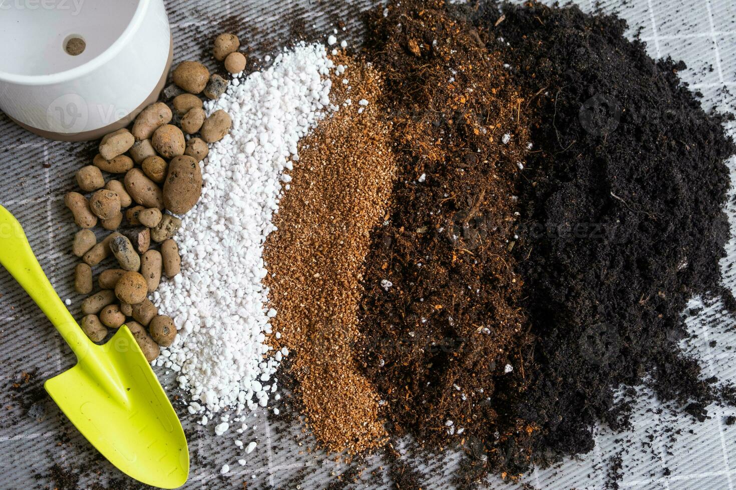 Ingredients for the soil of home potted plants, peat, earth, sand, perlite, vermiculite, coconut. A mixture for planting plants in a pot. Layout photo