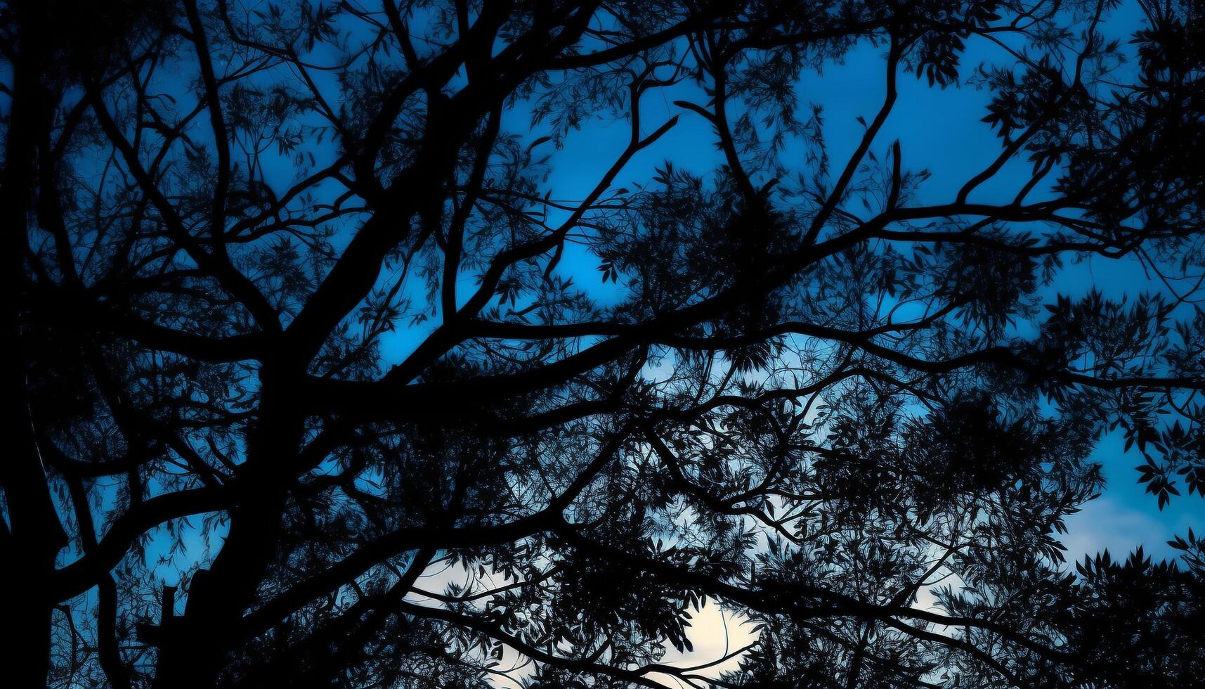 Silhouette of tree branch against dark blue sky generated by AI photo