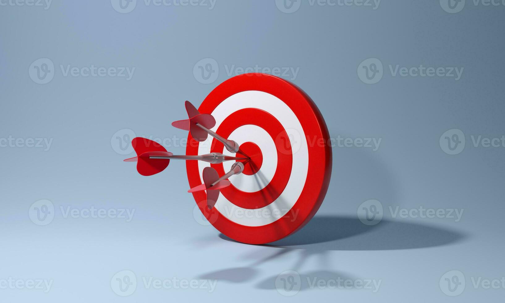 Red dart with arrow hitting target on blue background. Business aiming at the target concept. photo