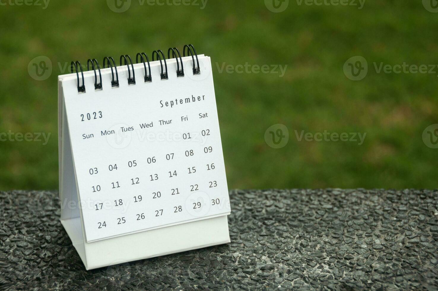 September 2023 table calendar with customizable space for text. Copy space and calendar concept. photo