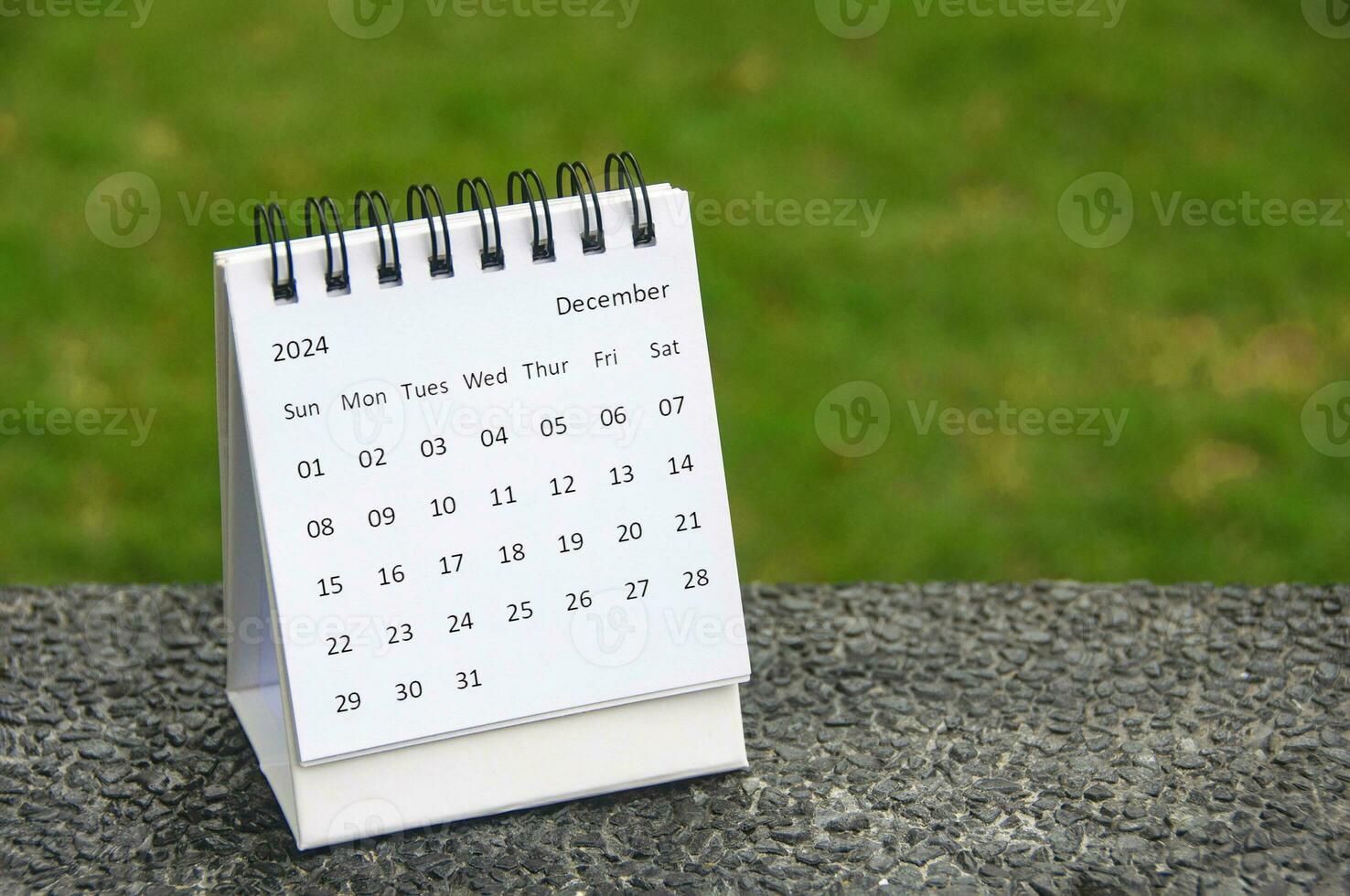 December 2024 table calendar with customizable space for text. Copy space. photo