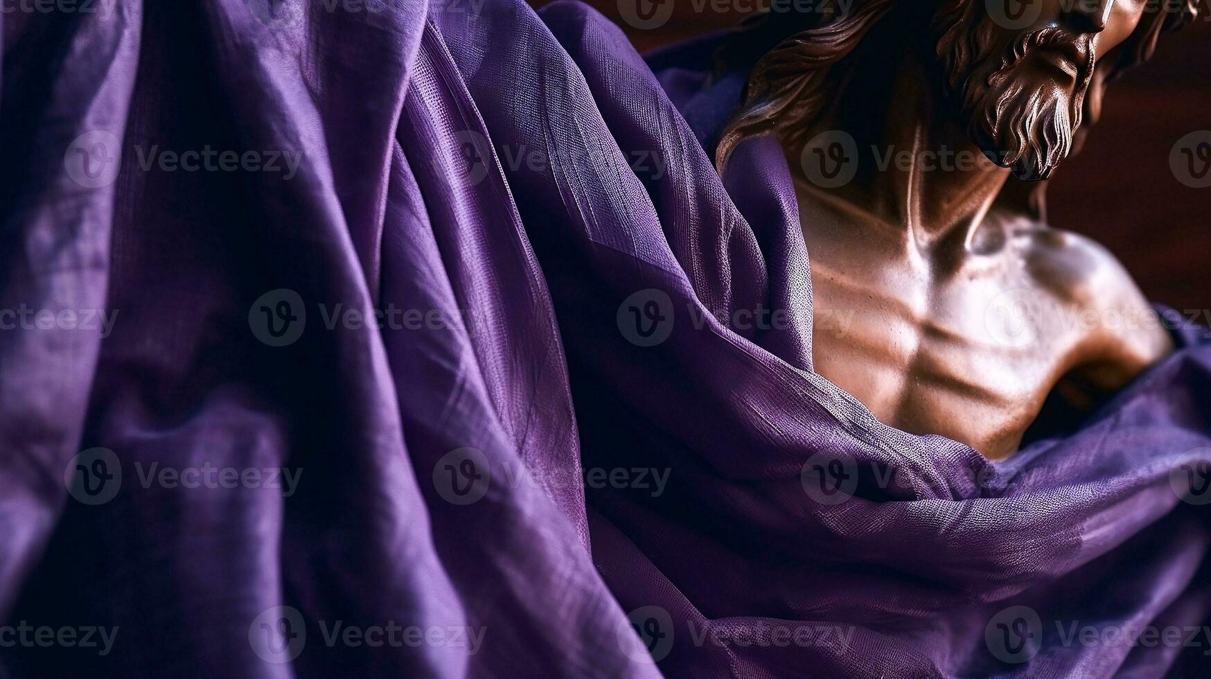 Status of Jesus Christ covered with purple shawl. Lent season, Holy week and Good friday concept photo