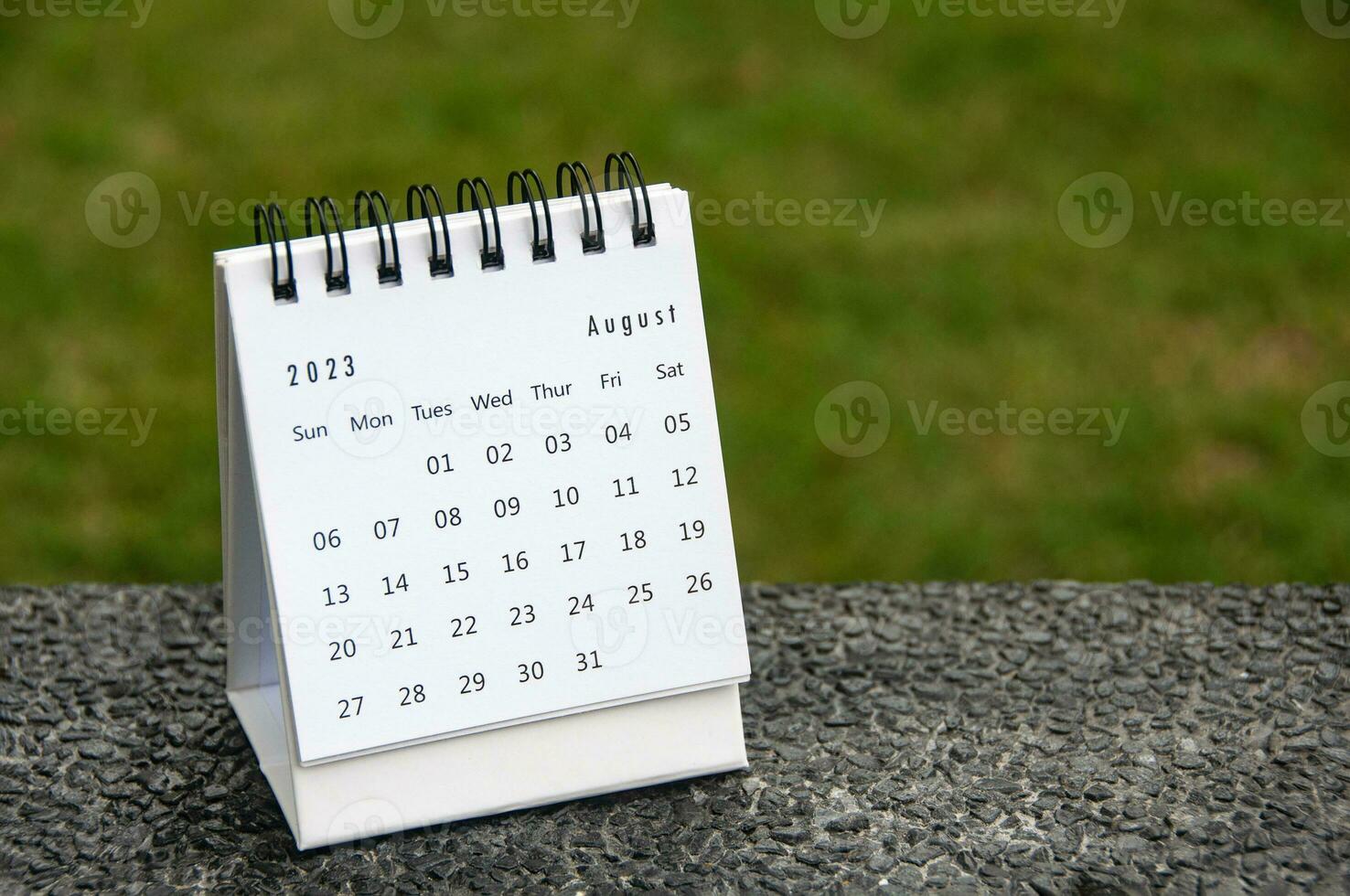 August 2023 table calendar with customizable space for text. Copy space. photo