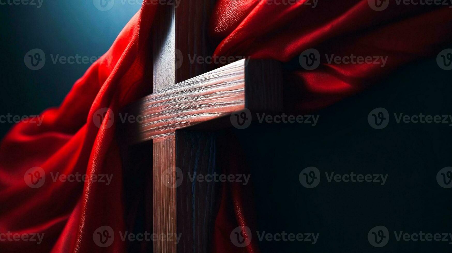 Wooden Cross of Jesus covered with red shawl. Lent season and Religion concept photo