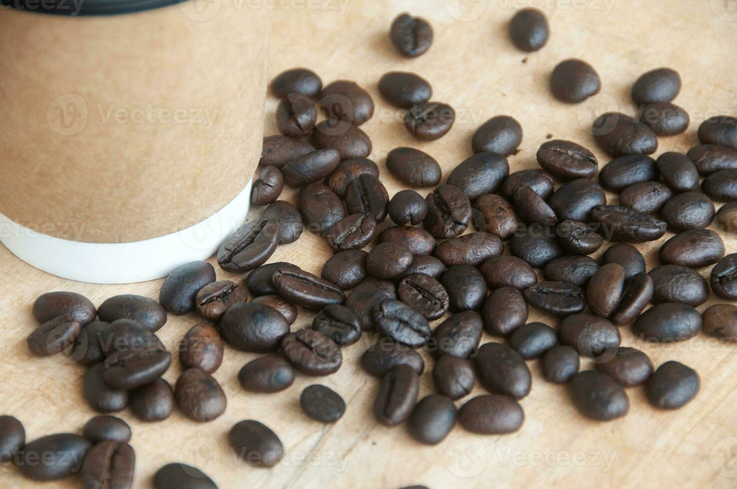 Takeaway cup surrounded by coffee bean with customizable space for text. Copy space and coffee concept photo