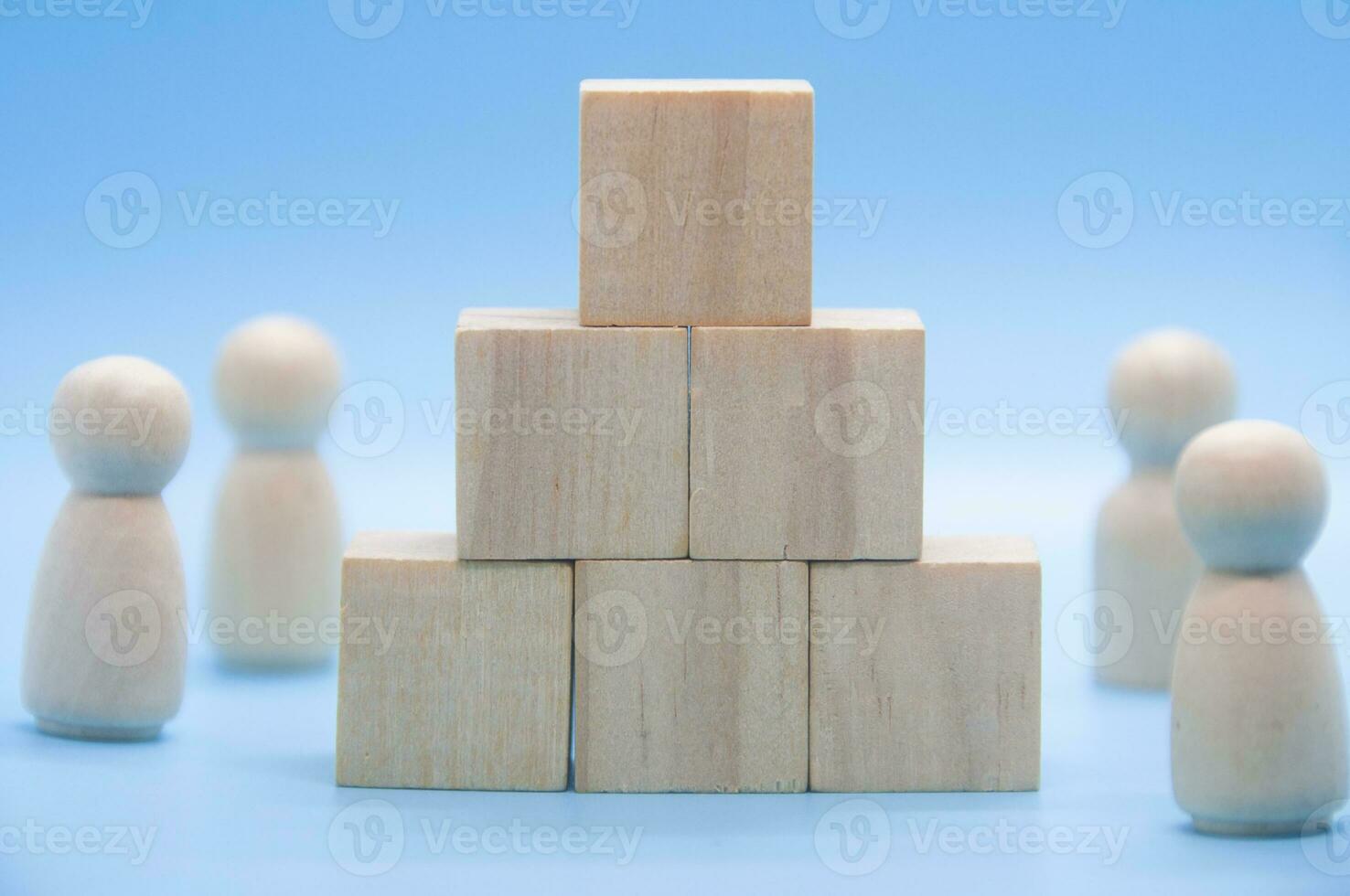 Stacking wooden cube on blue background with customizable space for text. Copy space photo