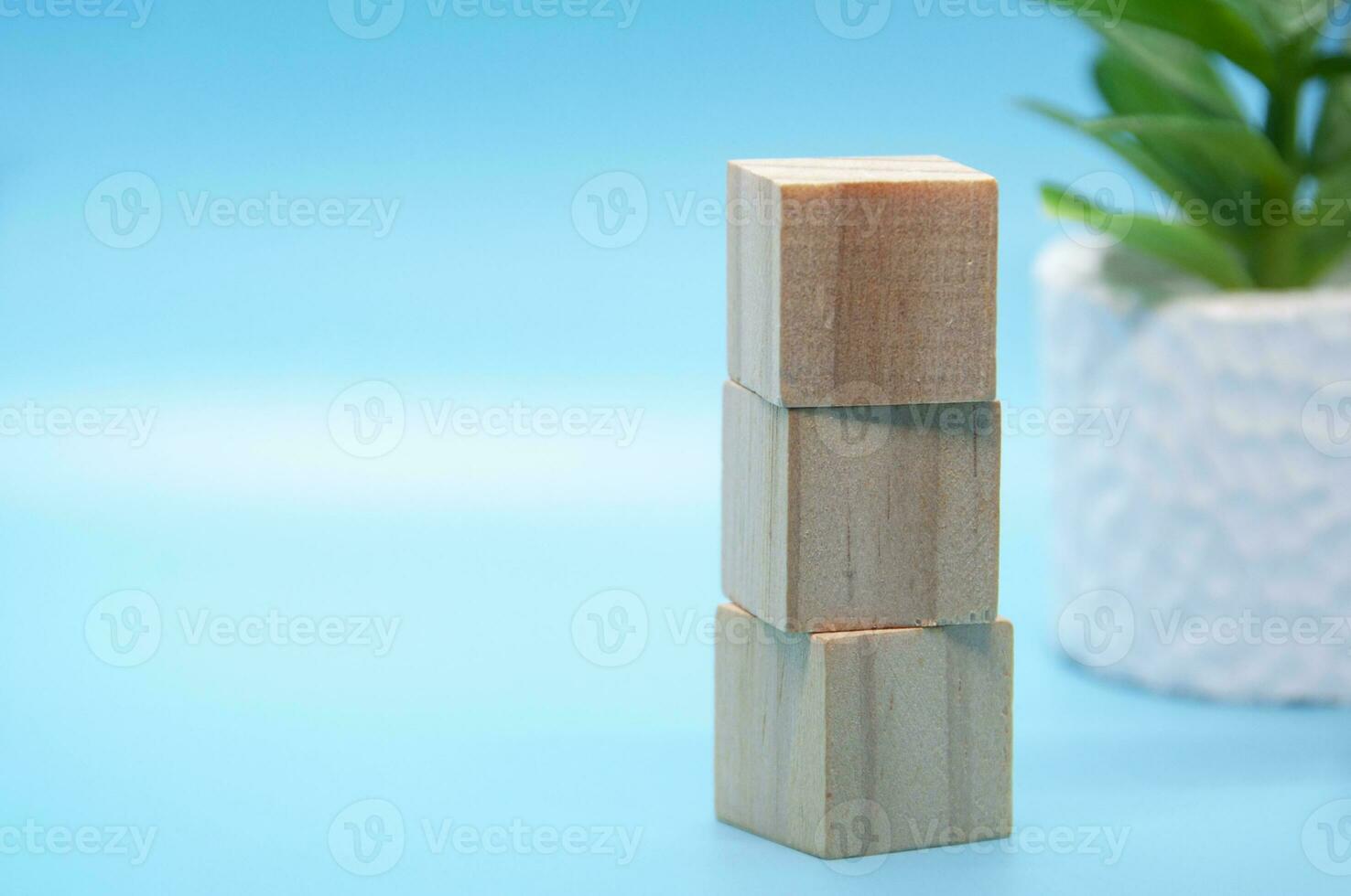 Wooden cube stacked on white cover background. Customizable space for text. Copy space. photo